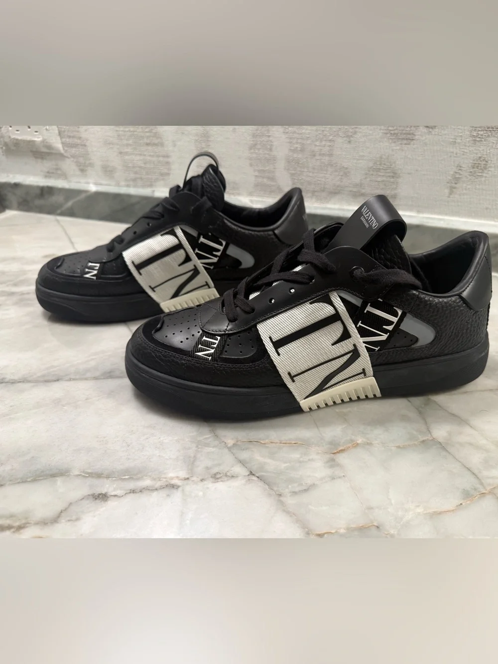 Valentino Garavani Black and White VLTN Strap Sneakers. Never worn